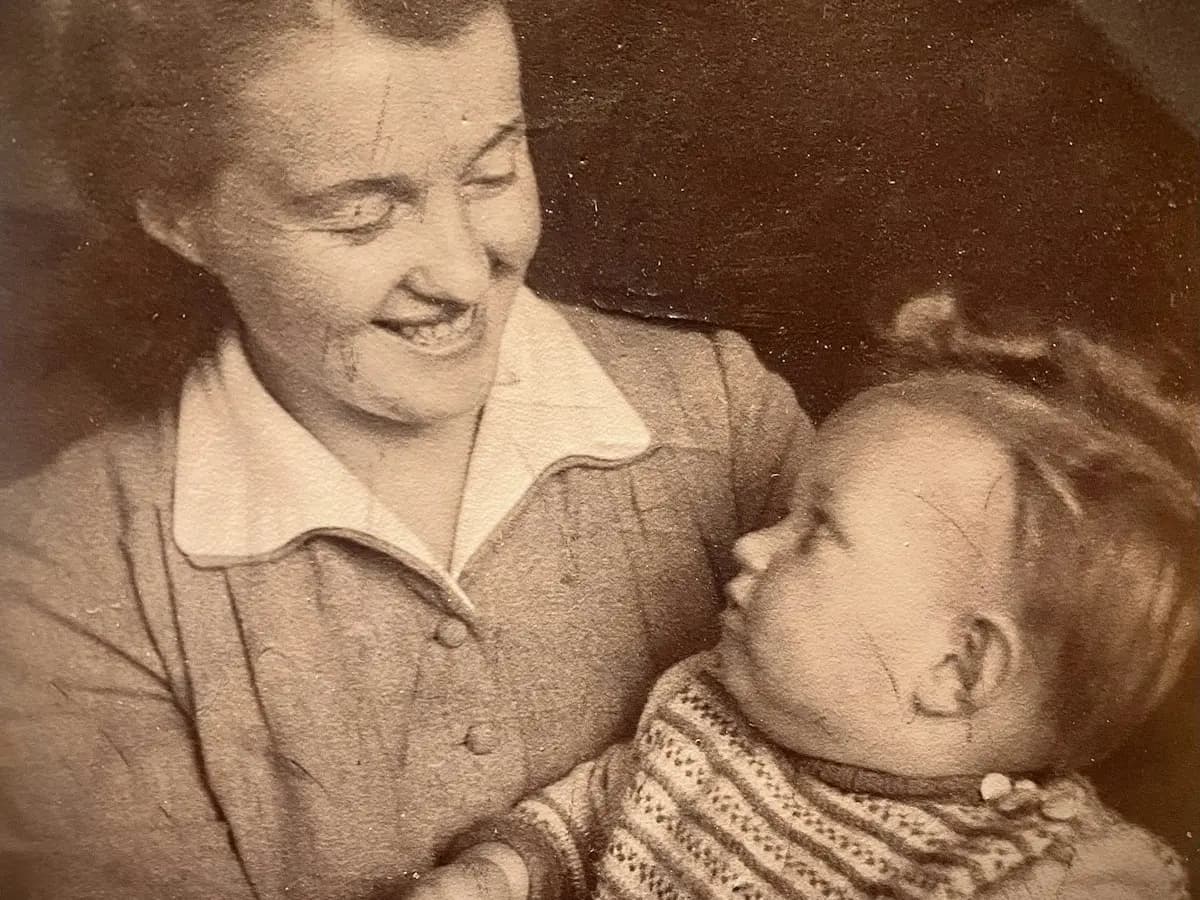Picture to Video AI animate photo AI putting motion into a creased darkroom print of a laughing elder